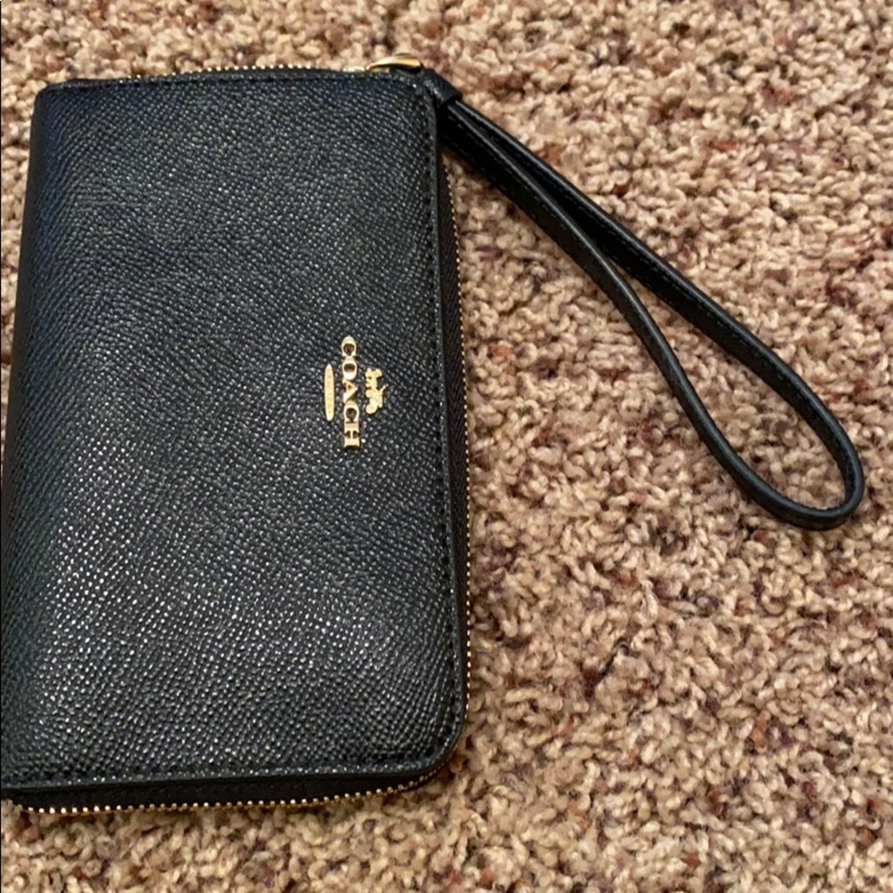 Coach black wristlet. Used 2x. EUC. $38
